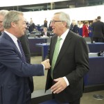 Handshake between Nigel Farage, Member of the EP, and Jean-Claude Juncker (in the foreground, from left to right)